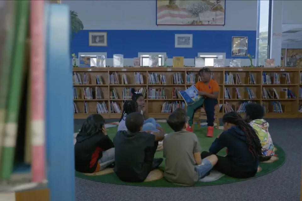 students reading in a library